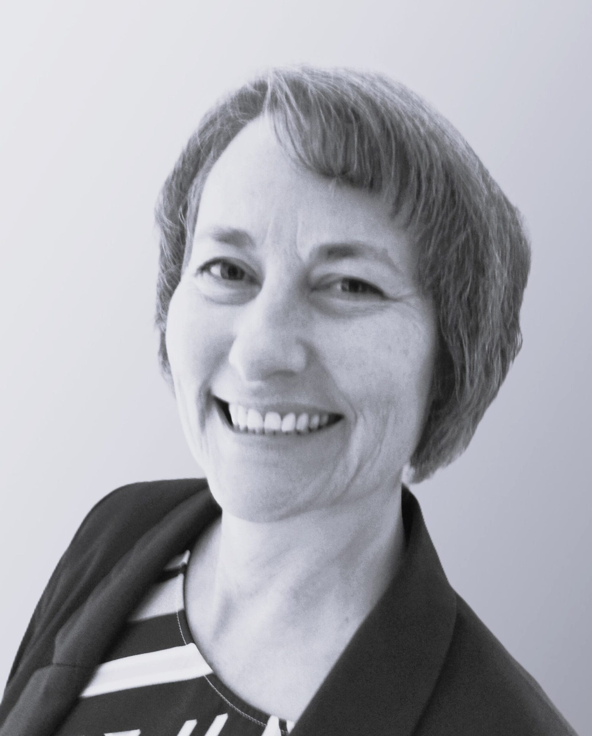 Porträtaufnahme einer Person als Mitarbeiterfoto für eine Unternehmensvorstellung.